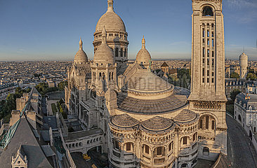 France. Paris (75) Aerial view of the Sacre Coeur basilica  at the top of the Montmartre hill. Its construction was decided in 1870 (just after the Franco-German war)  and was completed in 1914. With nearly 11 million pilgrims and visitors per year  it is the second most visited religious monument in Paris after Notre-Dame