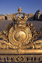 France.Yvelines (78) Palace of Versailles: aerial view of the royal emblems adorning the royal gate  at the entrance to the Palace: closed crown  laurel leaves  medallion and Cross of the Holy Spirit
