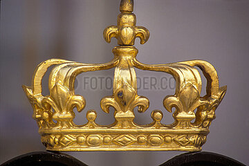 France. Yvelines (78) Palace of Versailles. Cour de Marbre: On the railing of the balcony of the King's chamber  royal emblem: closed crown
