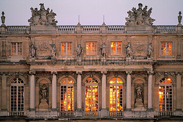 France. Yvelines (78) Palace of Versailles. The Galerie des Glaces (Hall of Mirrors)  decorative masterpiece whose realization was directed by Le Brun  receiving the last lights of the setting sun