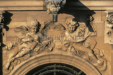 France. Yvelines (78) Palace of Versailles: On the south facade of the Chapel  aerial view of a decor sculpted on the windows of the gallery: angels playing the flute and the triangle