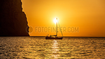 Spain  island of majorca. Boat at anchor at sunrise  Cala Sa Calobra.