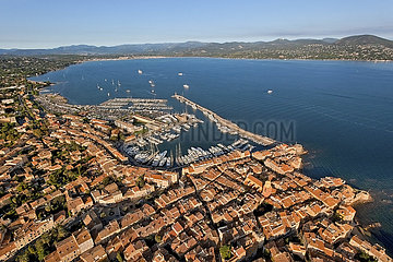 France - Provence-Alpes-Côte d'Azur - Var (83) - Saint Tropez and surroundings - La France Enchantée 7 - Song La Madrague by Brigitte Bardot: The port and the historic center of Saint Tropez seen from the South East. In the background  the Gulf of Saint Tropez and the Var coastline around Sainte Maxime.