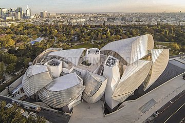 France. Paris (75) Bois de Boulogne. Aerial view of the Louis Vuitton Foundation who hosts permanent collections of contemporary art and temporary exhibitions. This emblematic building of the capital is signed Frank Gehry. At the request of Bernard Arnault (boss of LVMH  first French fortune and tenth in the world)  the architect imagined an iceberg resting on the water  enveloped by twelve huge glass sails  which seem to be inflated by the wind and play with the light and the sky. 40m high  this 11 000 m2 building is a formidable technical feat that overturns the principles of architecture: no less than thirty patents have been filed  a record.