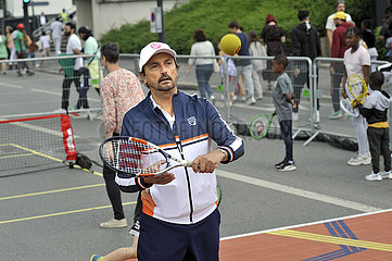 FRANCE. SEINE-SAINT-DENIS (93) TENNIS CHAMPION HENRI LECONTE ON OLYMPIC DAY NEAR STADE DE FRANCE  JUNE 26  2022. TWO YEARS BEFORE THE KICK-OFF OF THE GAMES  SEINE-SAINT-DENIS VIBRATE TO THE RHYTHM OLYMPIC.