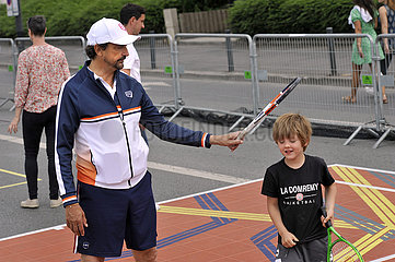 FRANCE. SEINE-SAINT-DENIS (93) TENNIS CHAMPION HENRI LECONTE ON OLYMPIC DAY NEAR STADE DE FRANCE  JUNE 26  2022. TWO YEARS BEFORE THE KICK-OFF OF THE GAMES  SEINE-SAINT-DENIS VIBRATE TO THE RHYTHM OLYMPIC.