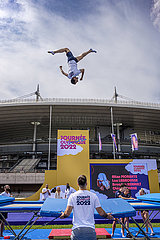 FRANCE. SEINE-SAINT-DENIS (93) OLYMPIC DAY ON JUNE 26  2022. TRAMPOLINE DEMONSTRATION. TWO YEARS BEFORE THE KICK-OFF OF THE GAMES  SEINE-SAINT-DENIS IS VIBRATING TO THE OLYMPIC RHYTHM. OLYMPIC DAY  NEAR THE STADE DE FRANCE. ON A PLAYGROUND SET UP NEAR THE STADE DE FRANCE  MORE THAN 30 SPORTS WERE THE SUBJECT OF DEMONSTRATIONS AND SPORTS INITIATIONS
