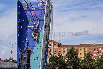 FRANCE. SEINE-SAINT-DENIS (93) OLYMPIC DAY JUNE 26  2022. CLIMBING INITIATION WALL. TWO YEARS BEFORE THE KICK-OFF OF THE GAMES  SEINE-SAINT-DENIS IS VIBRATING TO THE OLYMPIC RHYTHM. NEAR THE STADE DE FRANCE. ON A PLAYGROUND SET UP NEAR THE STADE DE FRANCE  MORE THAN 30 SPORTS WERE THE SUBJECT OF DEMONSTRATIONS AND SPORTS INITIATIONS.