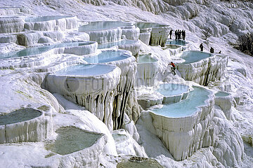 Turkey. Tuffiere of Pamukkale. Natural formation listed as a UNESCO World Heritage Site since 1988. Hot thermal springs overloaded with limestone salts  forming these basins. Meaning cotton castle in Turkish  the island site is made up of different terraced tuff springs  basins and white-colored waterfalls. A natural phenomenon reminiscent of a multi-storey glacier