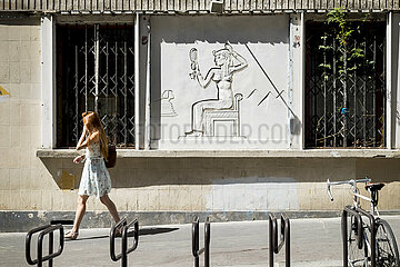 France. Paris (75) (9th district) Egyptian stucco motif  at 9  Turgot street. It was restored in 2016 after being hidden for decades. It represents a woman  whose dress and attitude refer to the Egyptian Pharaonic era
