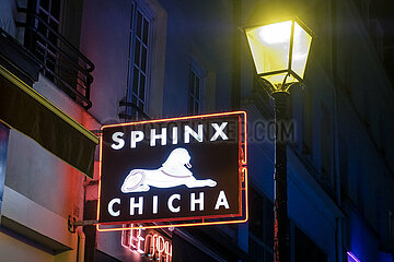 France. Paris (75) (14th district). The sign of the Sphinx Cafe  Gaite street  in the early evening