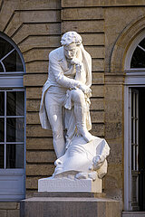 France. Paris (75) (5th district). The statue of Jean-François Champollion (by Frederic-Auguste Bartholdi)  erected in the courtyard of the College de France  had created a controversy when it was installed (Champollion's foot resting on an Egyptian head)