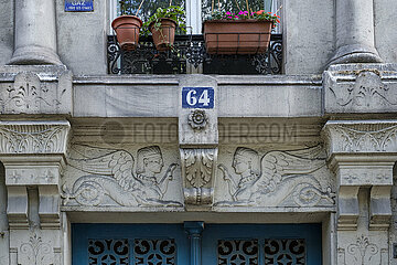 France. Paris (75) (10th district). Egyptian style door top (sphinxes)  at 64  boulevard de Strasbourg