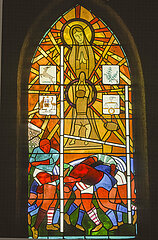 France. Aquitaine. Landes (40). Larriviere. A stained glass window in the Notre Dame du Rugby chapel depicts the Virgin and Child surrounded by rugby players  Jesus holding an oval ball