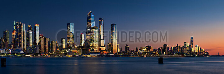 United States  New York City  Manhattan. Panoramic Sunset on Manhattan West with skyscrapers of Hudson Yards and the World Trade Center (Financial District). Cityscape from across the Hudson River