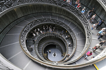 Italy. Lazio. Rome. Vatican Museums. The Bramante staircase is a famous monumental spiral staircase (allegorical double helicoidal)  which acts as an exit for the public. Reserved initially for riders  it was built in 1932 by the Italian architect Giuseppe Momo (pontificate of Pope Pius XI) and inspired by a nearby Renaissance staircase from the 16th century by the architect Bramante