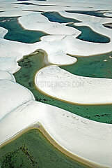 BRAZIL. NORDESTE. STATE OF MARANHAO. AERIAL VIEW OF LENCOIS MARANHENSES NATIONAL PARK. A UNIQUE PLACE IN THE WORLD: IMMACULATE WHITE SAND DUNES WAVING FOR TENS OF KILOMETERS  PUNCTUATED BY FRESHWATER LAKES. ONE OF THE MOST BEAUTIFUL NATIONAL PARKS IN THE COUNTRY