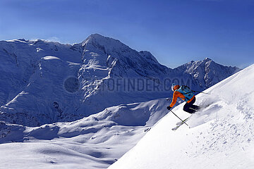 France. Alps. Savoie (73) Savoie (73) Sainte Foy Tarentaise  skiing on the south face of the Pointe de la Fogliettaz  opposite Mont Pourri (3777 m) Model Release OK