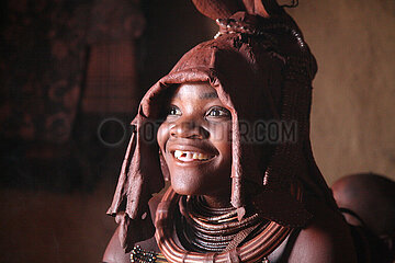 NAMIBIA  Kaokoland region  Opuwo  Young Himba in his hut having put on his wedding clothes and jewelry