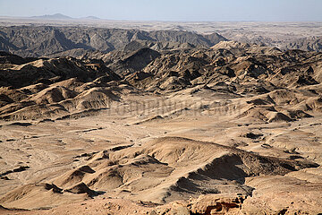 NAMIBIA. Wetwitchia plains with lunar landscape  Namib desert