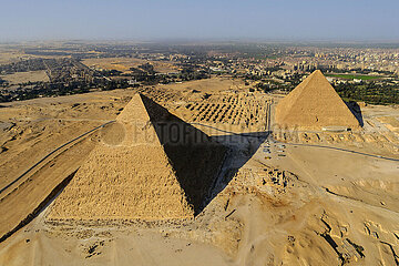 Egypt. Cairo. Gizeh (or Giza) Aerial view of the site. In the foreground  the pyramid of Chephren. In the background on the left  the western mastabas of the necropolis. In the background on the right  the pyramids of Kheops  Khephren and Mykerinos (IVth dynasty). In the background on the right  the city of Giza (western suburb of Cairo)