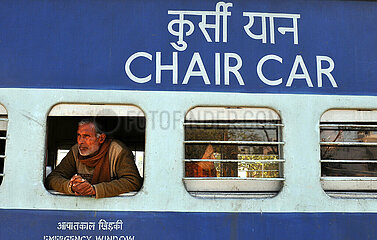 India. Rajasthan. A train passenger in a seat car (3rd class)
