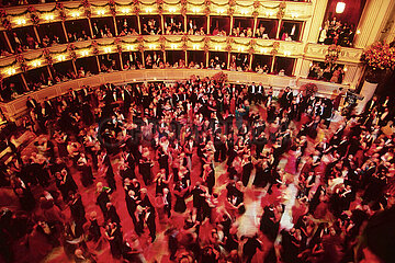Austria. Vienna. The balls season. Couples dancing the waltz at the ball of the Opera which starts the ball season in february.