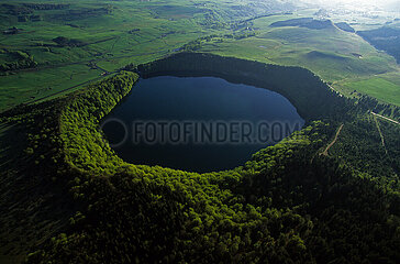 France. Puy-de-Dome (63) Regional Natural Park of the Volcanoes of Auvergne. Aerial view of Lac Pavin. This lake of volcanic origin  formed by pheatomagmatism 6 900 years ago  is located in the Monts Dore. It is the youngest volcano in metropolitan France.