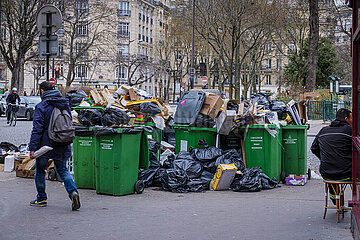 France. Paris (75) (14th district). At the beginning of March 2023  trash cans and rubbish pile up on the sidewalks  following a garbage collectors' strike  in protest against the government's pension reform project (here  Denfert-Rochereau square)