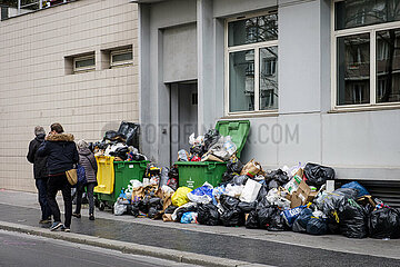 France. Paris (75) (14th district). At the beginning of March 2023  trash cans and rubbish pile up on the sidewalks  following a garbage collectors' strike  in protest against the government's pension reform project (here  Sante street)