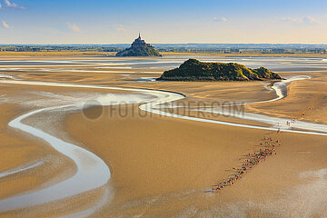 France. Normandy. Manche (50) Aerial view of the bay of Mont-Saint-Michel. The unique experience  crossing the bay at high low tide