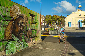 FRANCE  WEST INDIES  GUADELOUPE  MARIE-GALANTE ISLAND  CAPESTERRE-DE-MARIE-GALANTE  STREET WALL PAINTING OF A CANE CUTTER