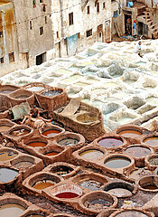 MOROCCO. FES. THE TANNERS' SOUK  OUTSIDE THE MEDINA  IN THE CHOUARA DISTRICT (WORLD HERITAGE SITE BY UNESCO). SKIN WORK IN COLORED POOLS
