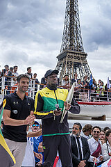 FRANCE. PARIS (75) (16TH DISTRICT) PORT DEBILLY  CELEBRATION AND PRESENTATION OF THE PARIS 2024 OLYMPIC TORCH BY TONY ESTANGUET (PRESIDENT OF PARIS 2024)  USAINT BOLT (OLYMPIC ATHLETICS CHAMPION)  AND FRENCH ATHLETES  IN FRONT OF SUPPORTERS OF THE FRENCH OLYMPIC TEAM