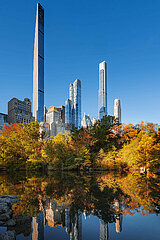 UNITED STATES  NEW YORK CITY  MANHATTAN. CENTRAL PARK IN FALL WITH VIEW ON THE MIDTOWN BILLIONAIRES ROW SKYSCRAPERS (INCLUDING STEINWAY TOWER  ONE57  CENTRAL PARK TOWER AND 220 CENTRAL PARK SOUTH)