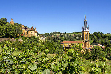 FRANCE. RHONE (69) CASTLE AND CHURCH OF JARNIOUX VILLAGE LOCATED IN THE LAND OF THE GOLDEN PIERRES