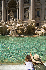 ITALY  ROME. TOURISTS NEAR THE TREVI FOUNTAIN