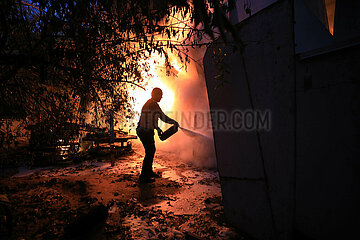 MIDEAST-GAZA-KHAN YOUNIS-PLASTIC FACTORY-ISRAEL-ATTACK-FIRE