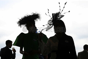Royal Ascot  Fashion: Women with hats silhouetted against the sky