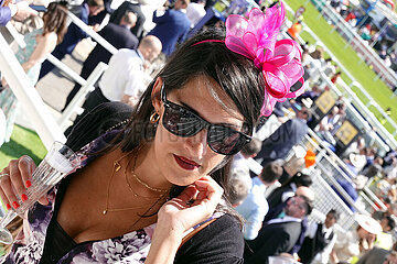 Epsom Downs  Fashion: Woman with hat at the racecourse