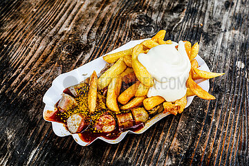 Delicious German Duo: Currywurst & Fries with Mayo