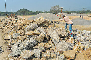 Workers Dedicate Themselves to Breaking Rocks In Stone State