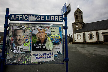 Posters of presidential candidates torn in a rural commune. Affiches de candidats à l'élection présidentielle déchirées dans une commune rural.