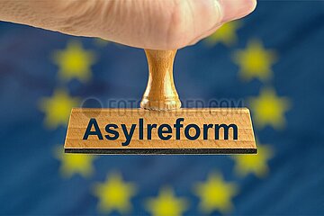 Symbolischer Stempel Asylreform