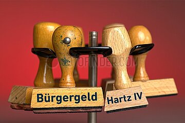 Zwei symbolische Stempel Bürgergeld & Hartz IV