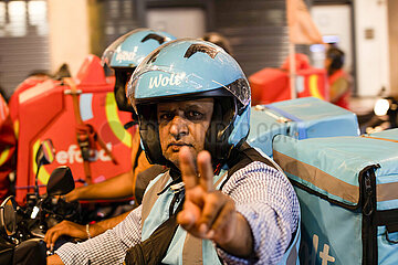 Greece: Delivery workers drive their motorcycles demanding better working conditions.