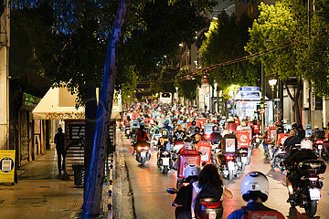 Greece: Delivery workers drive their motorcycles demanding better working conditions.