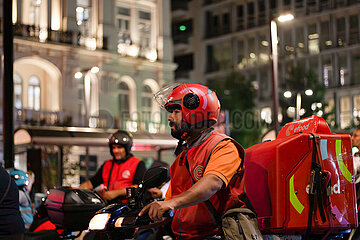 Greece: Delivery workers drive their motorcycles demanding better working conditions.