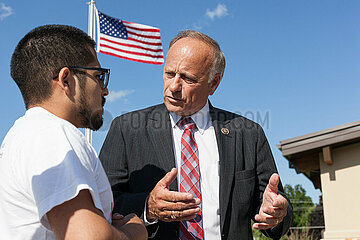 U.S. Representative Steve King visits Hector Salamanca Arroyo about immigration before the arrival U.S. Republican presidential candidate Donald Trump before talks with local residents as he tours the museum and birthplace of actor John Wayne