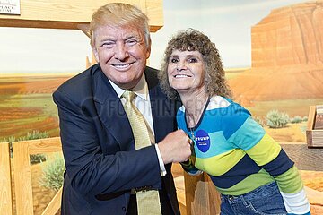 U.S. Republican presidential candidate Donald Trump poses with supporters as he tours the museum and birthplace of actor John Wayne